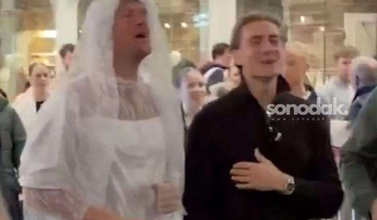 gelinlik-giyip-sarki-soyledi-tepki-gelince-kendini-bakin-nasil-savundu-iRB2fCgr.jpg
